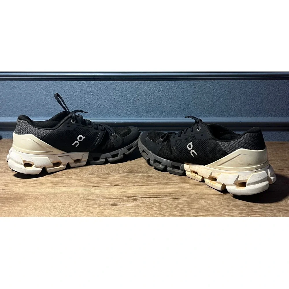 On Cloudnovel Women's Black and Cream Athletic Shoes